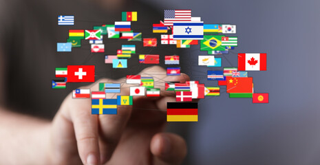 Conceptual image of global interconnectedness, representing the world and international collaboration. Hand interacting with flags symbolizing g
