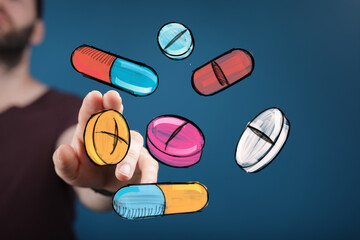 Colorful pills and capsules float around a hand, symbolizing healthcare, medicine, or pharmacy.