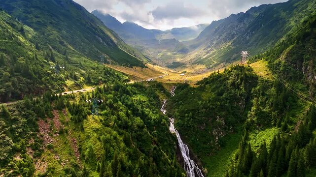 Fantastic scenery of green mountains with a waterscape. View on the valley among the rocks crossed by the famous Transfagarash Road.