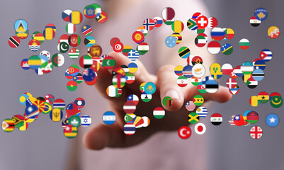 A person's hand interacting with floating flags from around the world, symbolizing global unity,...