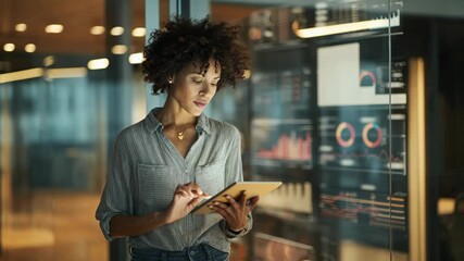 Medium shot of a businesswoman receiving instant alerts on her tablet highlighting critical data changes for quick decisionmaking in a modern office. - Powered by Adobe