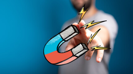 Powerful image of a hand attracting customers with a magnet. Ideal for marketing, business, and sales concepts.