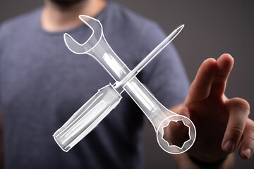 Obraz premium Image of crossed wrench and screwdriver, symbolizing repair, maintenance, and technical support. Ideal for websites and presentations need