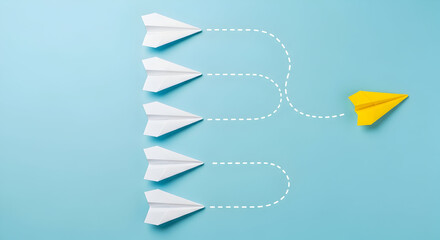 A yellow paper airplane stands out and flies in a different direction from the rest, symbolizing unique business and leadership strategies that work well.