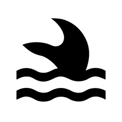 A black silhouette of a shark fin above the water