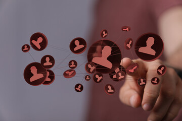 Abstract concept of human resources and social networking connecting technology with a digital interface displayed by a person.