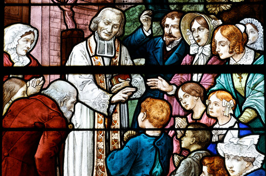 Saint Jacques church.  Stained glass. Saint Jean-Marie Vianney, parish priest of Ars. Angers. France.