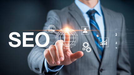 Businessman touching holographic globe with SEO text and digital icons search engine optimization digital marketing