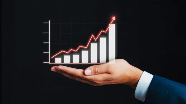 Businessman's Hand Holding Upward Trending Financial Growth Bar Chart and Line Graph finance