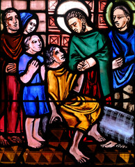 Fototapeta premium Saint-Pierre de Pernef church. Stained glass. Life of Peter the apostle. Saint Peter heals a sick person at the gate of Jerusalem. France.