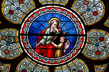 Saint Seine church.  Stained glass. Matthew is often symbolized by an  angel, representing his focus on the humanity of Christ and the lineage of Jesus. Corbigny. France.