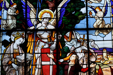 Saint Seine church.  Stained glass. Joan of Arc the Maiden with the Archangel Saint Michael. Corbigny. France.