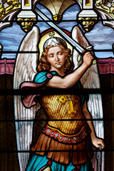 Obraz premium Saint Andew church. Stained glass. Archangel. Boege. France.