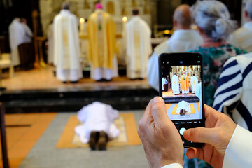 Saint Jacques church. Diaconal ordination ceremony. Prostration. Sallanches. France.