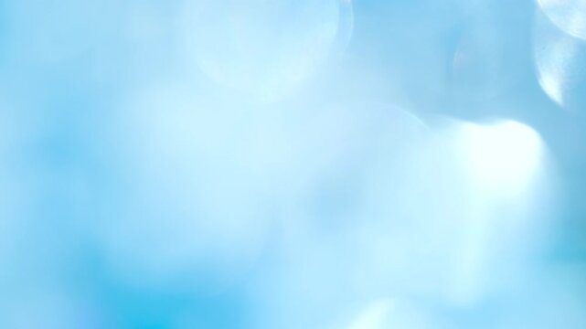 Optical Effects in Celestial Tones. Loop. A large number of sparkling faceted crystals shimmer and create romantic bokeh