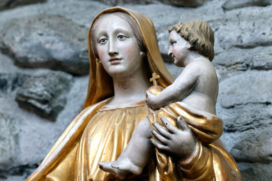 Praz sur Arly church. The Virgin Mary carrying the baby Jesus in her arms. France.