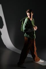 Stylish teenager exploring youth culture in a modern urban setting