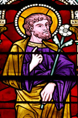 Bayeux cathedral. Stained glass. Saint Joseph holding a lily, symbolizing purity, integrity, and his role as the protector of the Holy Family. Bayeux.  France.
