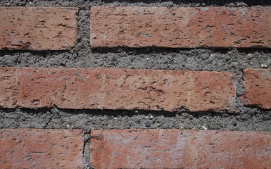 Wall with exposed red bricks