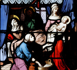 Fototapeta premium Church of the Cordeliers. Stained glass. Saint Anne gives birth to the Virgin Mary. Lons le Saunier. France.