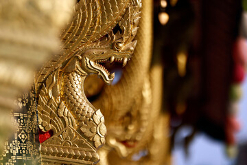 Vat Xieng Thong buddhist temple. Traditional buddhist golden dragon sculpture.  Luang Prabang. Laos.