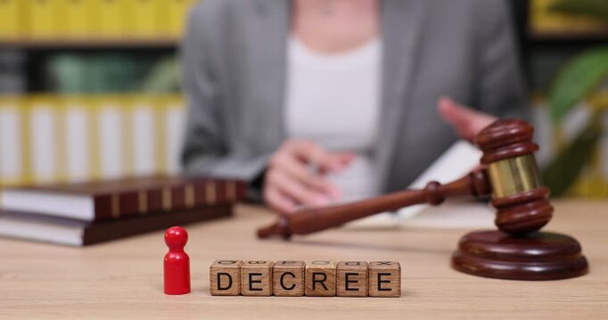 Legal proceedings unfold as decree is prepared at a bustling office filled with files and documents