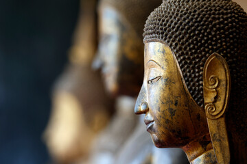 Wat Visounnarath buddhist temple. Wooden Buddha ( calling for the rain position ).  17 th - 18 th century. Wood, lacquer, gold leaf.  Luang Prabang. Laos. © Godong Photo