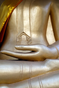 Bhumisparsha mudra.  The gesture of taking the earth to witness symbolizes the moment of the Buddha's Awakening, when he calls the Earth to bear witness to his determination.  Luang Prabang. Laos.