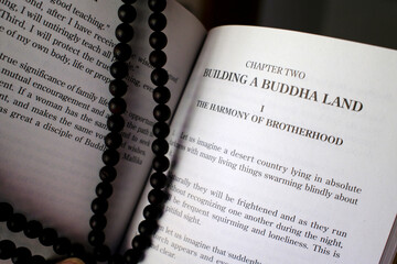 Buddhist liturgical book. The teaching of Buddha. Buddhist prayer beads. Luang Prabang. Laos.
