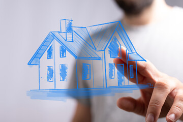 Conceptual depiction of a house drawing held by a hand. Perfect for real estate, construction,...