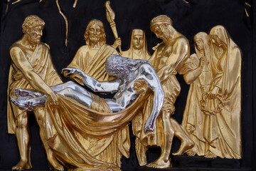 Obraz premium My Tho cathedral. Way of the cross. Station 13. Jesus is taken down from the cross. My Tho. Vietnam.