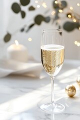 Elegant champagne glass on marble table in sunlit setting