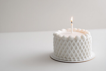 Minimalist Birthday Cake with a Single Lit Candle on a White Surface, Celebrating a Milestone