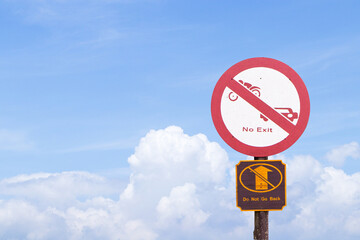 Old white aluminum circle sign No exit, traffic sign on street in park with blue sky cloud white is background. Car and motorcycle icon symbols. Traffic warning sign: Do not exit.