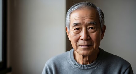 Portrait of a Thoughtful Senior Asian Man with Gray Hair.