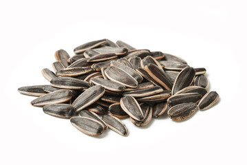 Sunflower seeds scattered isolated on a white background showcasing their unique shape, color, and texture for healthy snacks and recipes