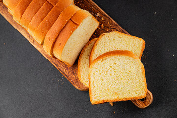 Brioche bread slices bakery pastry natural product tasty snack fresh delicious gourmet food background on the table rustic top view copy space
