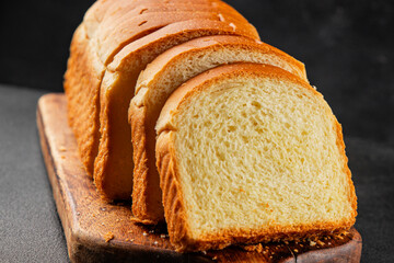 Brioche bread slices bakery pastry natural product tasty snack fresh delicious gourmet food background on the table rustic top view copy space