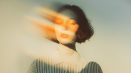 Blurry portrait of a woman with dynamic light and shadow effects, creating a surreal and dreamy atmosphere.