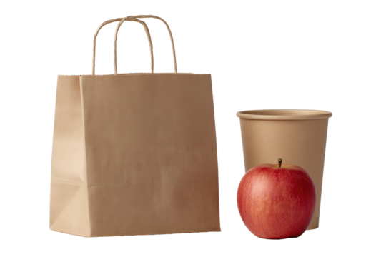 Brown paper shopping bag with a red apple and a disposable cup isolated on transparent background