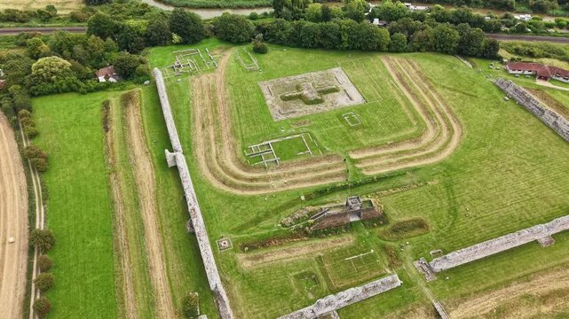 Drone footage orbiting the ancient ruins and earthworks of Richborough Roman Fort, Kent