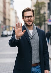 Fototapeta premium Cheerful young man in urban setting gesturing encouragement