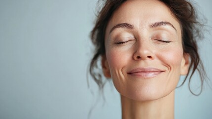 Smiling woman with closed eyes peaceful expression
