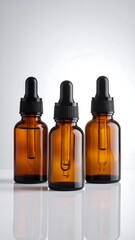Three amber glass dropper bottles