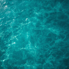 Fototapeta premium Aerial shot of shallow coastal waters blending turquoise and teal hues, soft sunlight shimmering through gentle waves, cinematic high-resolution texture emphasizes calm movement, balanced