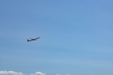 Los Angeles, California, beach under the airfield Airplane flying on blue sky