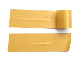 Two pieces of light gold-colored tape, unrolled,  resting on a white background