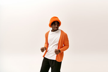 Young man exudes confidence and style in vibrant colors at a modern indoor space