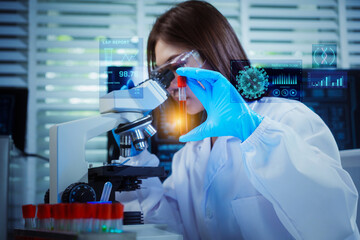 Asian female scientist in blue gloves simultaneously looks into a microscope while holding a test tube, with holographic virus, DNA, and lab data floating as a digital overlay.