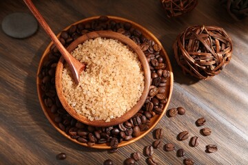 Natural sea salt and coffee beans on wooden table, flat lay
